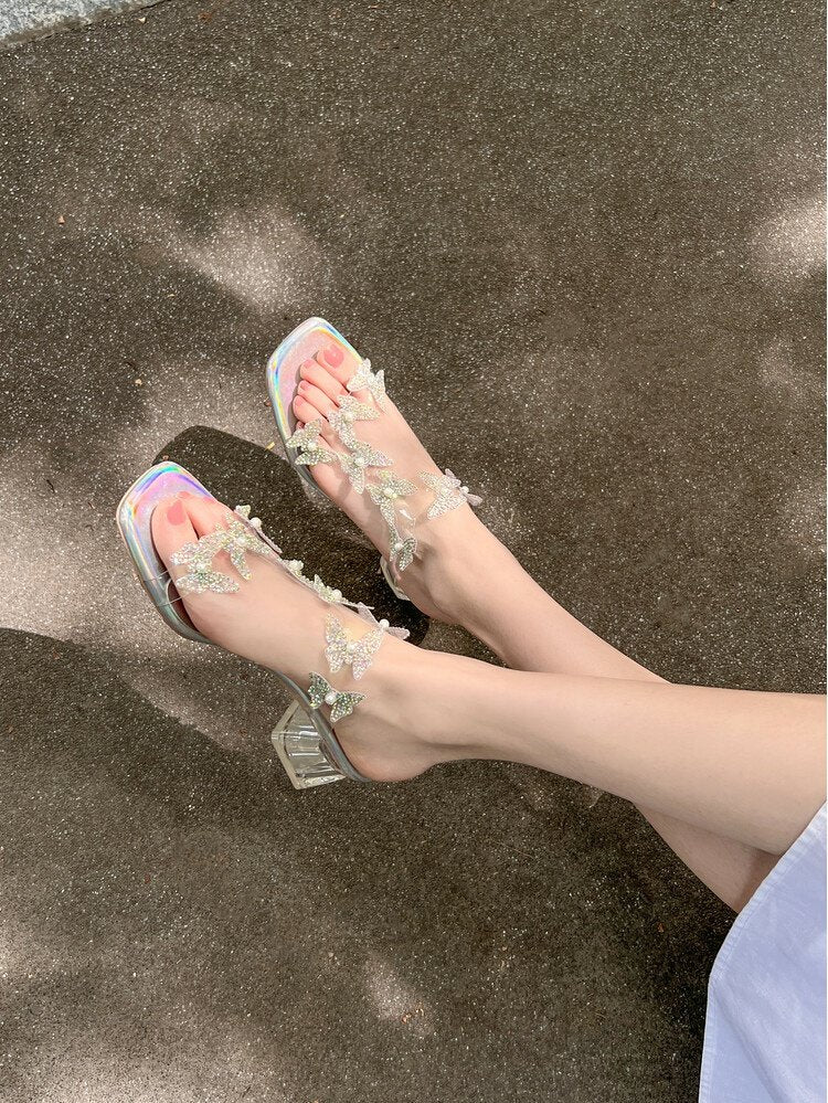 Lost in the Butterfly Valley! Exquisitely beautiful summer sandals with a fairy-like style, featuring blingy transparent butterfly crystal heels, perfect for wearing outdoors.